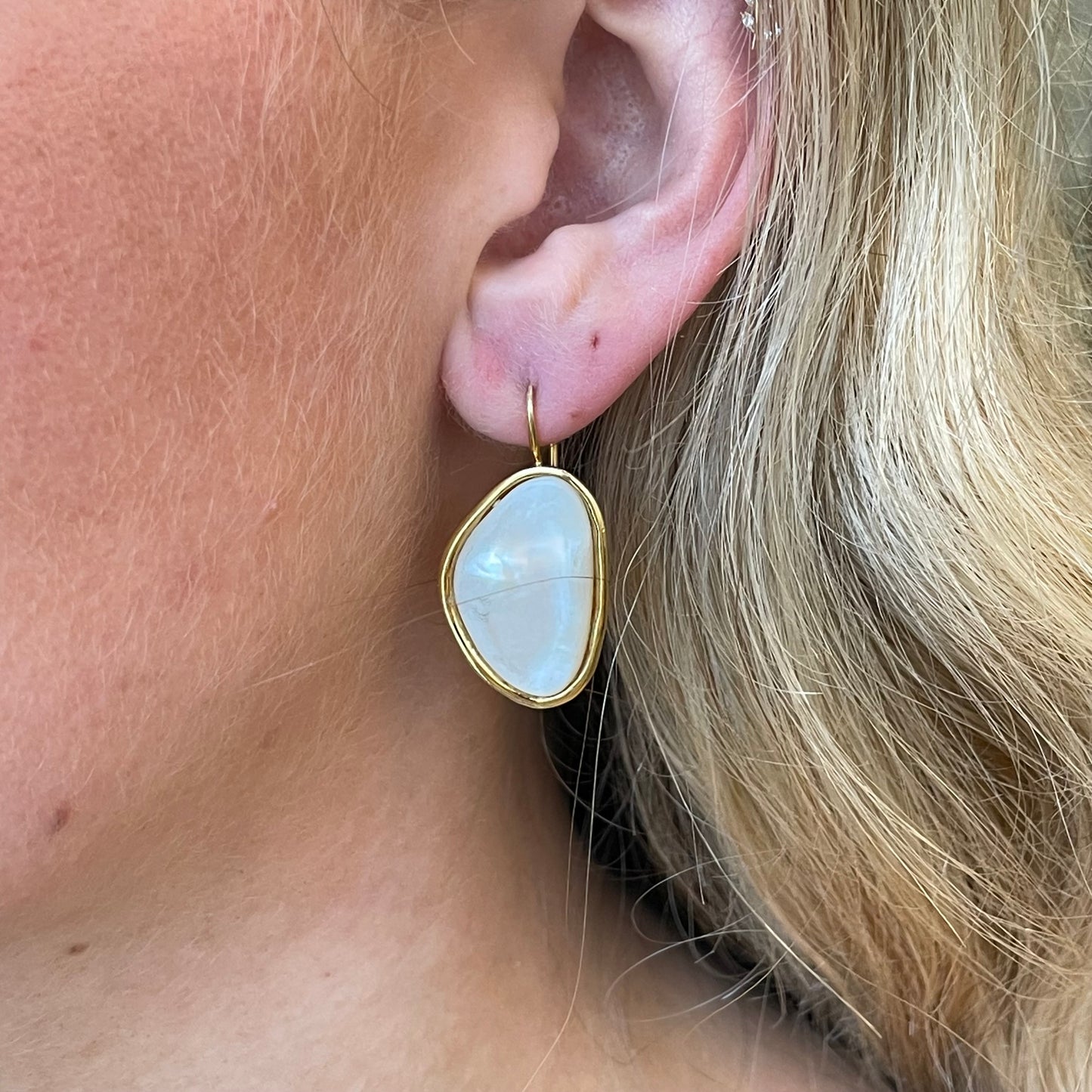 Bruno mother of pearl drop earrings, 32mm by 18mm, featuring iridescent pearl accents and elegant dangle design.