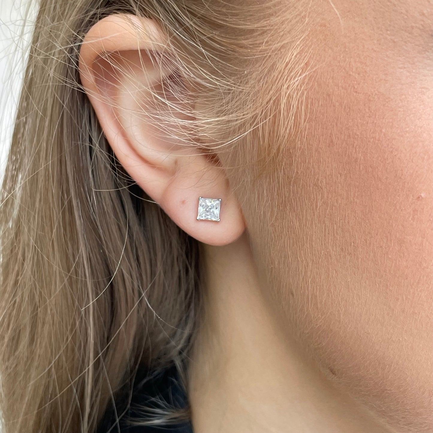 Silver 5mm four claw princess cut CZ stud earrings by Insignia, showcasing sparkling cubic zirconia in a classic earring design.