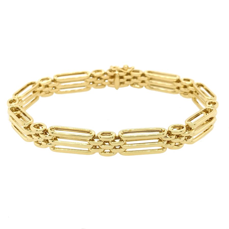 Close-up of a 9ct gold three bar gate bracelet by Mark Milton, showcasing the sleek design and polished finish.