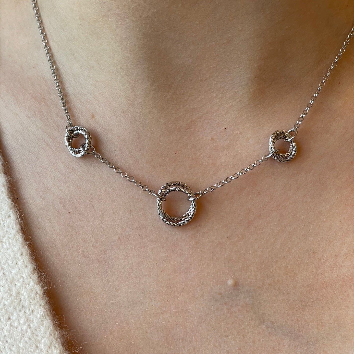 Silver Pretty Trilogy Necklace by Fraboso featuring three linked circular pendants on a delicate chain.