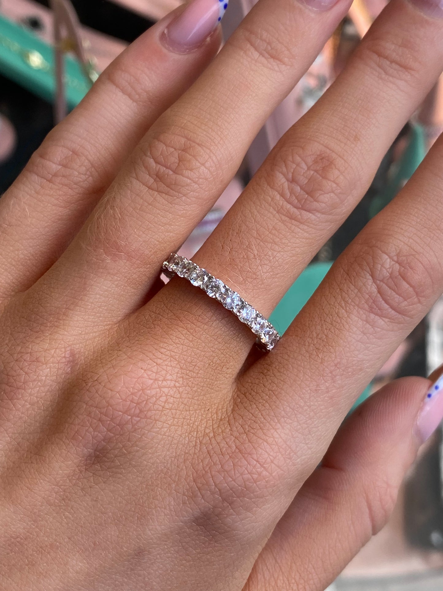 Silver Trisha ring by Comero featuring a sleek band and minimalist design, displayed on a neutral background.