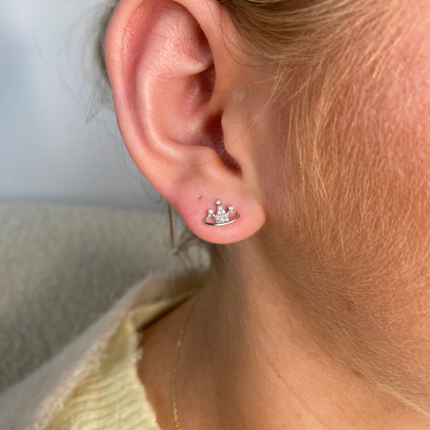 Silver CZ orb stud earrings for kids by Comero, featuring shiny round gemstone accents in a simple, elegant design.