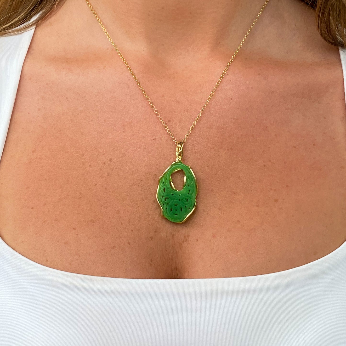 Bruno jade oval pendant necklace featuring a polished green jade stone on a delicate chain.