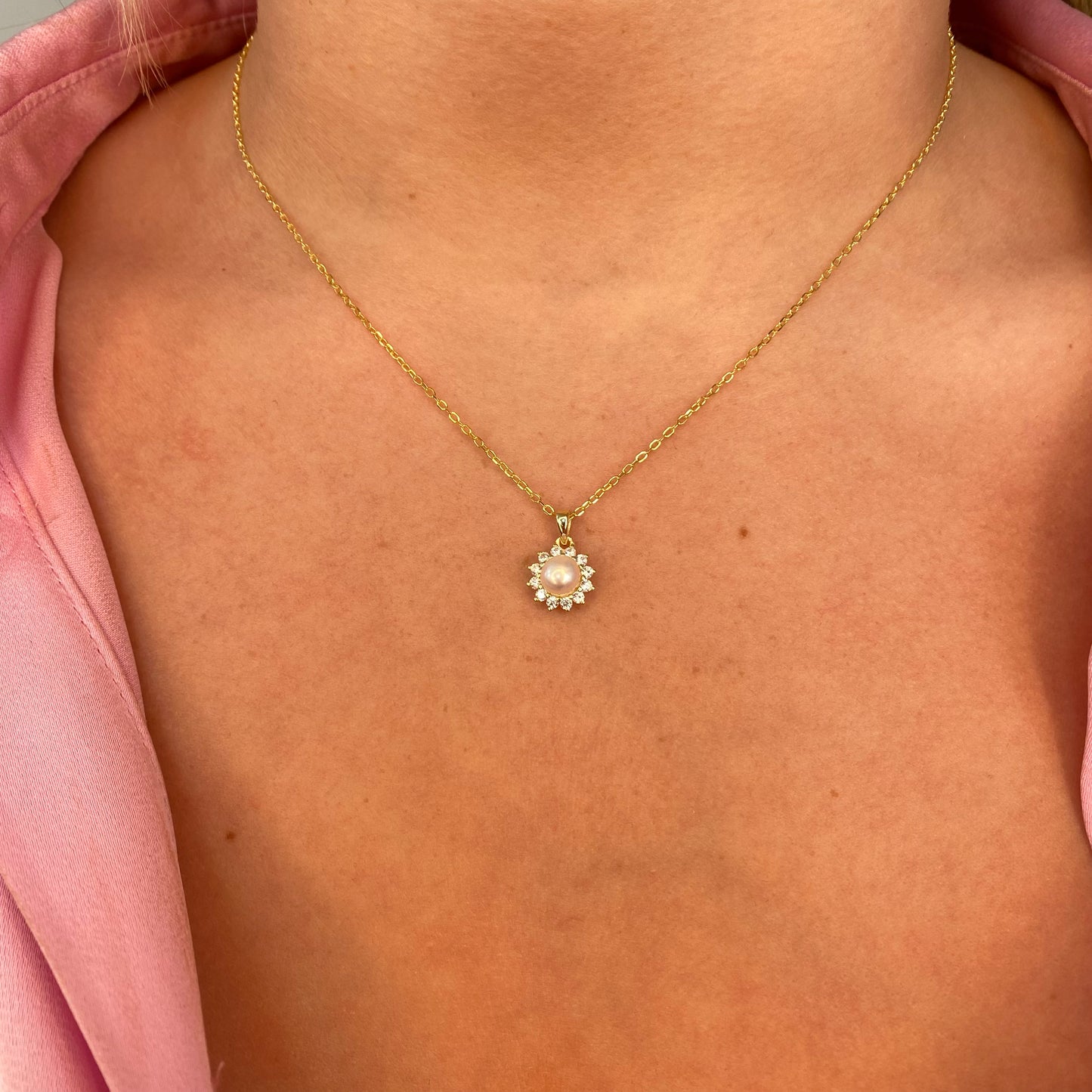Comero Sunshine Pearl and CZ halo earring and necklace set featuring sparkling pearl and cubic zirconia accents.