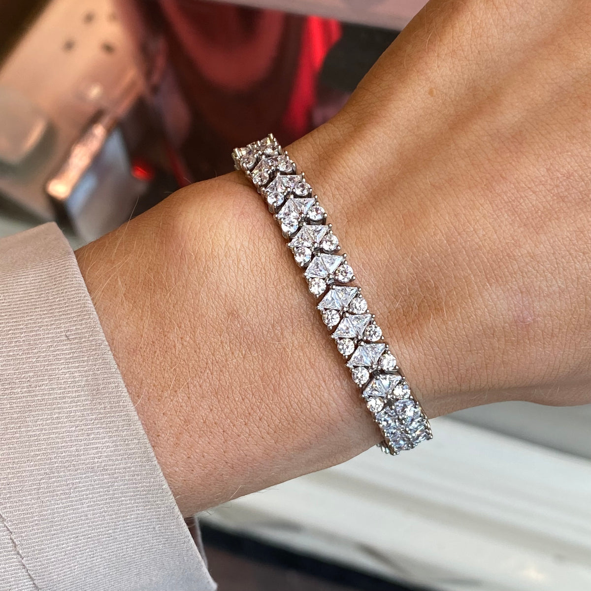 Silver CZ tennis bracelet by Comero with sparkling cubic zirconia stones on an 18cm chain.
