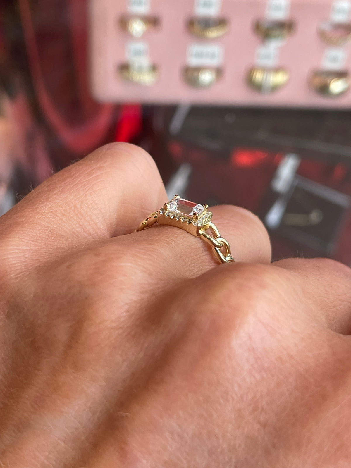 Comero Sunshine Radiant CZ Halo Chain Ring featuring sparkling cubic zirconia and a sleek silver band.