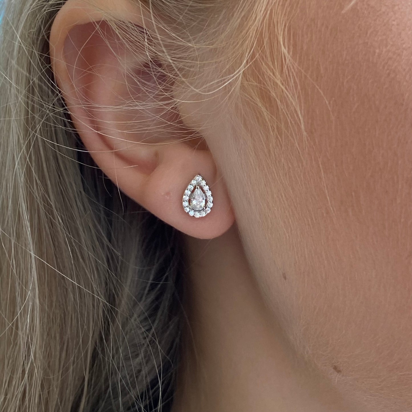 Silver CZ Pear Halo Stud Earrings by Insignia featuring pear-shaped cubic zirconia in a halo setting