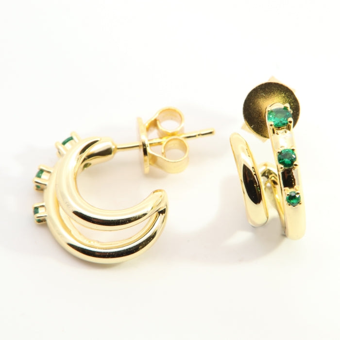 Sunshine Green CZ hoop earrings by Comero featuring vibrant green cubic zirconia stones and classic hoop design.