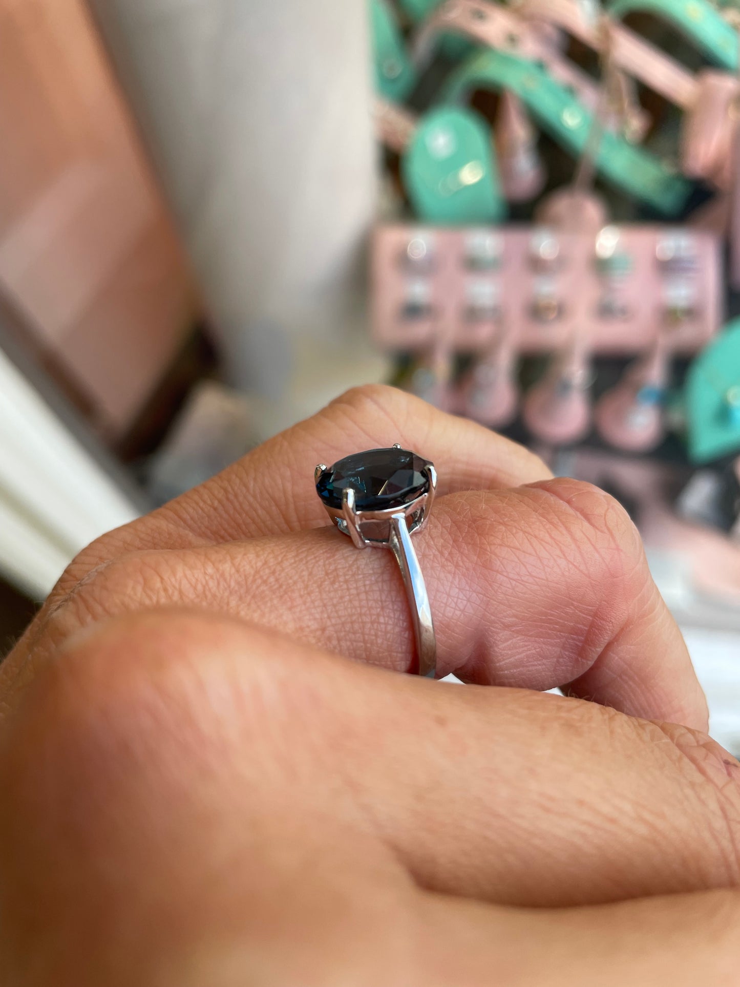 Herbert 9ct white gold oval cut London Blue Topaz ring with a central blue gemstone and smooth band.