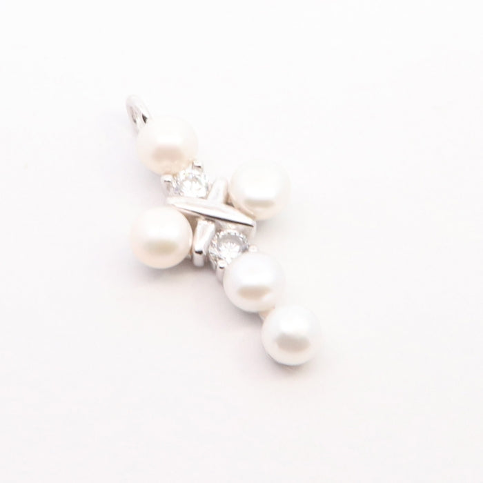 Silver CZ and 5mm freshwater pearl cross necklace from Comero, 18-inch length, featuring a delicate cross pendant.