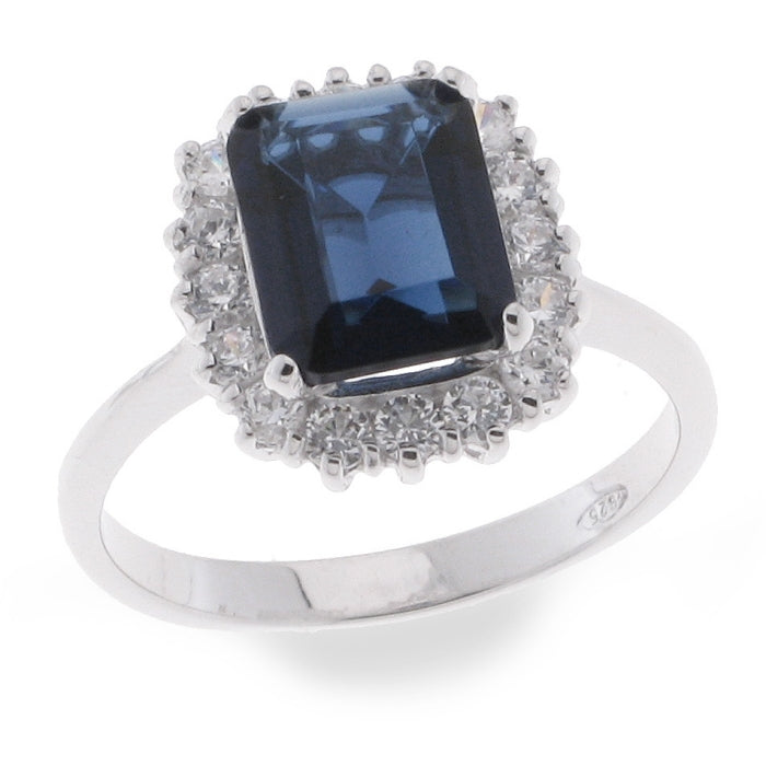 Silver sapphire blue CZ statement ring by Comero featuring a large central gemstone and intricate band design.