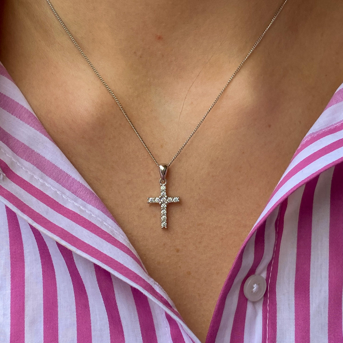 Silver Classic CZ Cross Necklace by THC featuring a medium-sized pendant on a sleek chain.