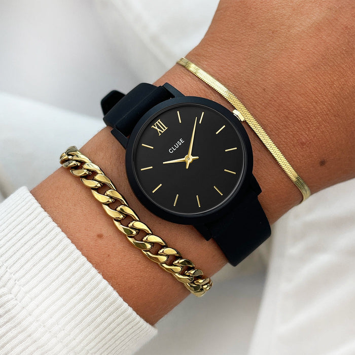 Cluse black shop and gold watch