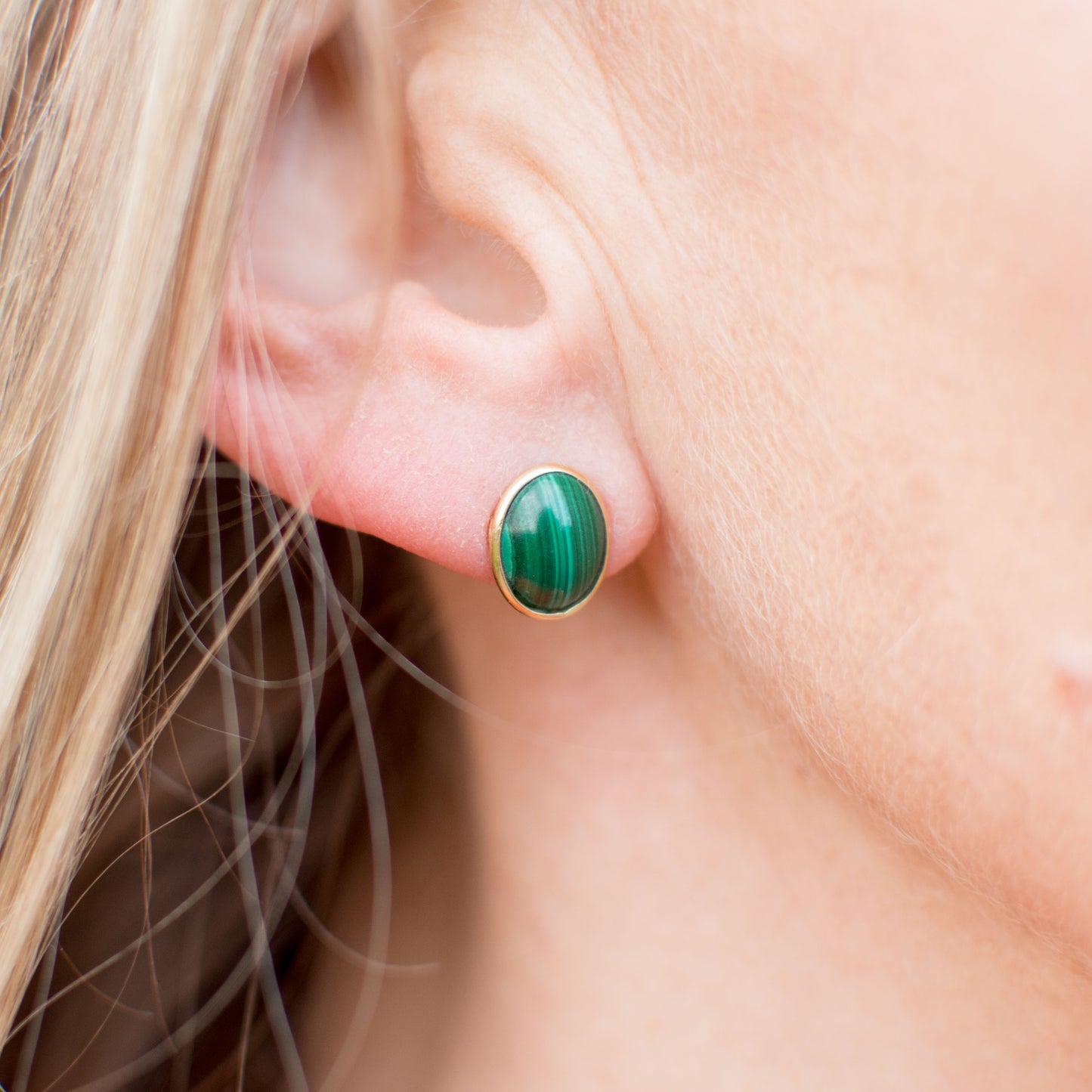 10mm x 8mm Malachite 18ct yellow gold Glowing combinations of cultured pearls, natural stones and gold are the focus of our Natural Beauty collection. These exquisite materials have natural imperfections that delight with their uniqueness. Each item from this collection is handmade and one off. We can provide the same designs in a range of colours and alloys. The product shown is the one that you would buy. Natural materials like turquoise and cultured pearls have unique colour variations.