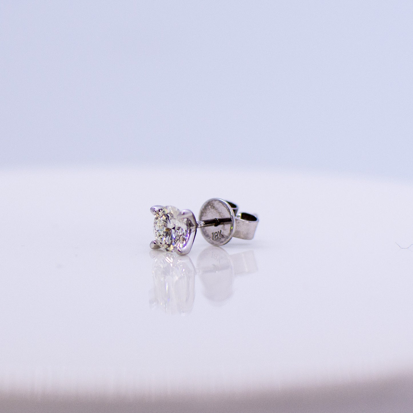 18ct White Gold 1ct Diamond Stud Earrings Each diamond is set in a classic four claw setting. 1ct in total approximately. 18ct white gold stud earrings with butterfly backs.
