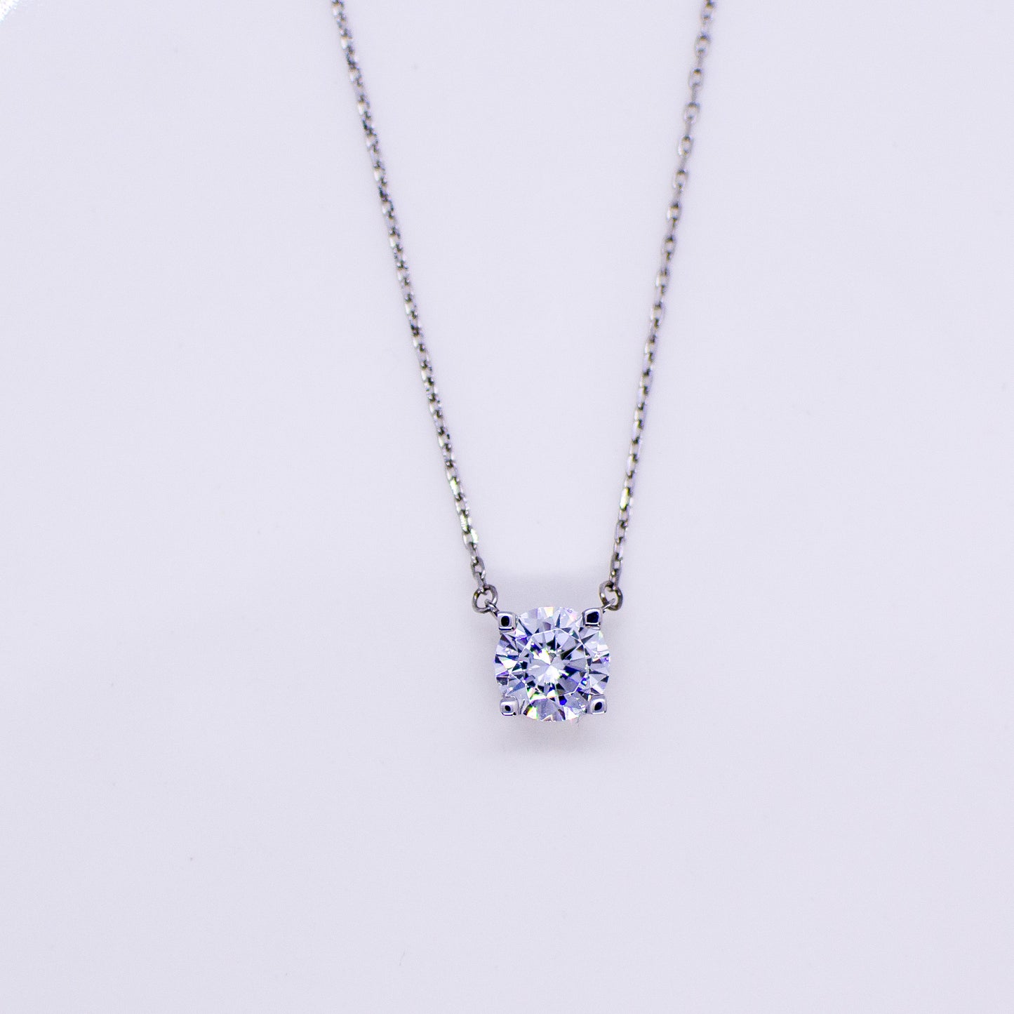 9ct white gold CZ solitaire necklace with a central sparkling cubic zirconia gemstone, showcasing elegant jewelry design.