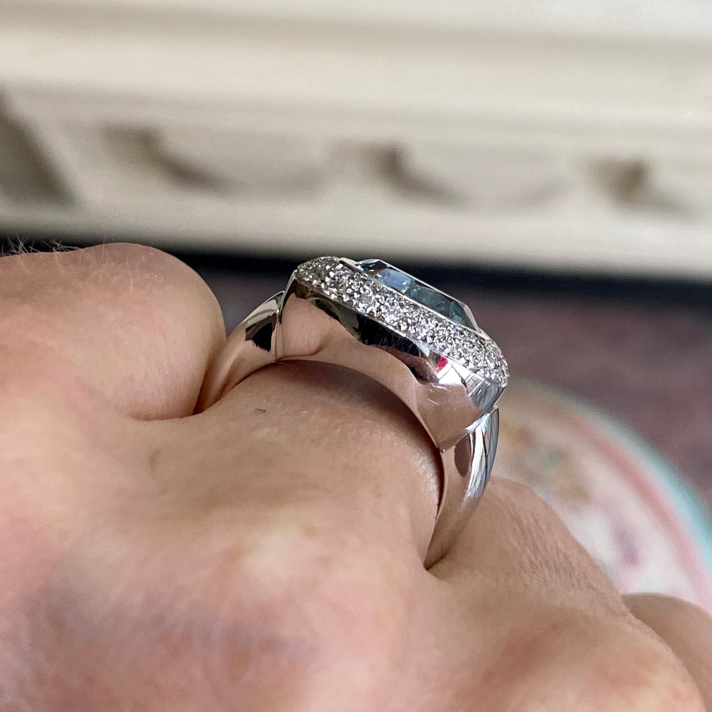 Leo Wittwer 18ct white gold aquamarine and diamond ring with a central aquamarine gemstone and surrounding diamonds.