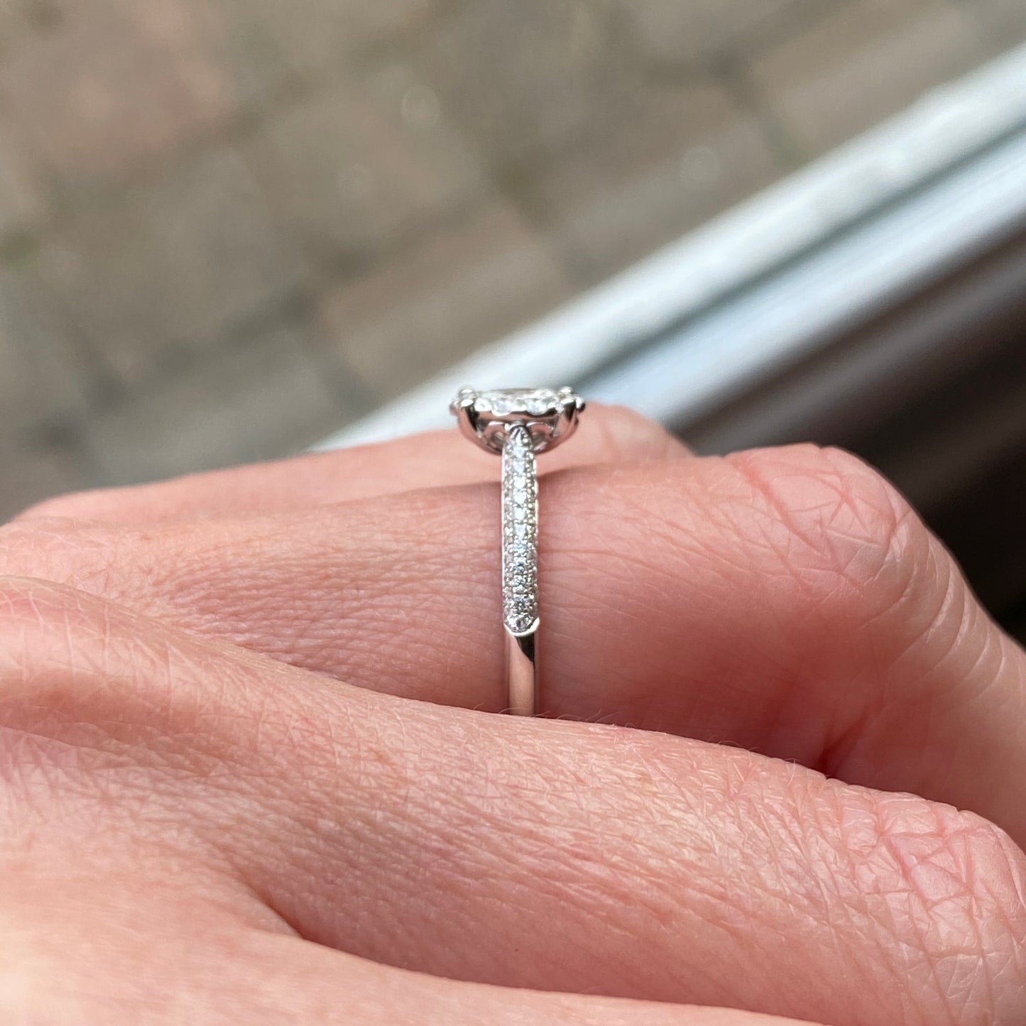 This oval cluster diamond engagement ring is a complete classic. Its simplicity is so romantic. The Details... One 18ct white gold diamond engagement ring. Diamond halo cluster in an oval shape with pavé diamond-set shoulders. 0.79ct in total of diamonds. Colour G. Clarity VS. Centre stone: 0.23ct Melée: 0.56ct 18ct white gold. Size N.