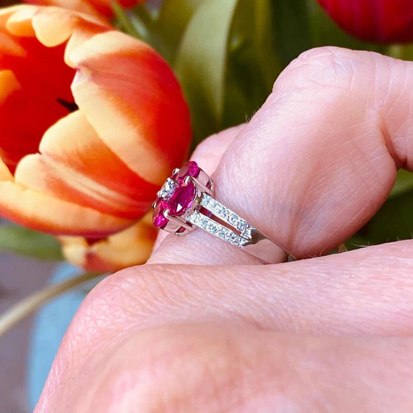 18ct white gold pink sapphire and diamond quatrefoil ring by FEU, featuring a sparkling pink sapphire centerpiece with diamond accents.