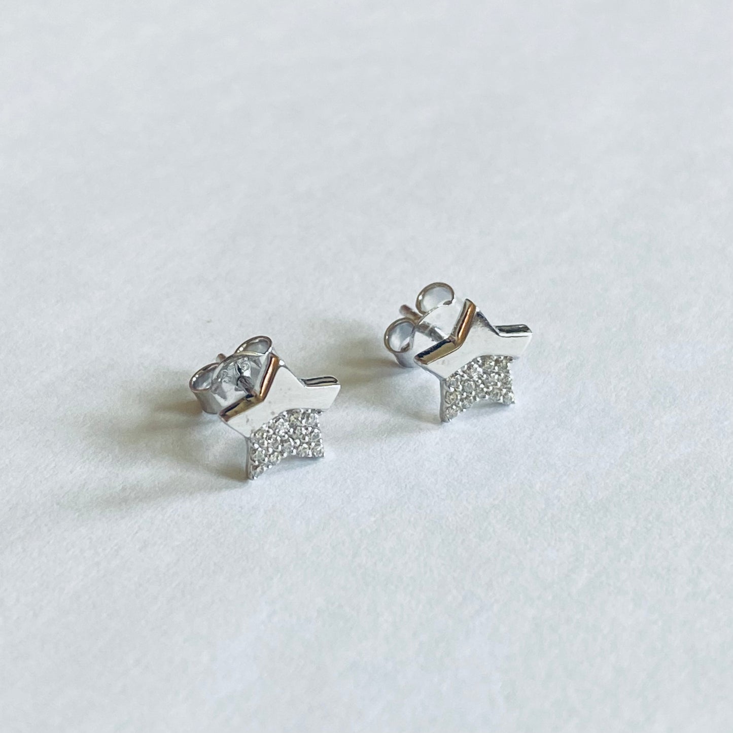 NJO 9ct white gold star-shaped cubic zirconia stud earrings displayed on a white background.