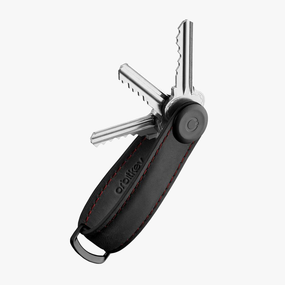 OrbitKey Crazy Horse Key Organizer in Obsidian Black with red stitching, showcasing sleek leather design and compact key storage.