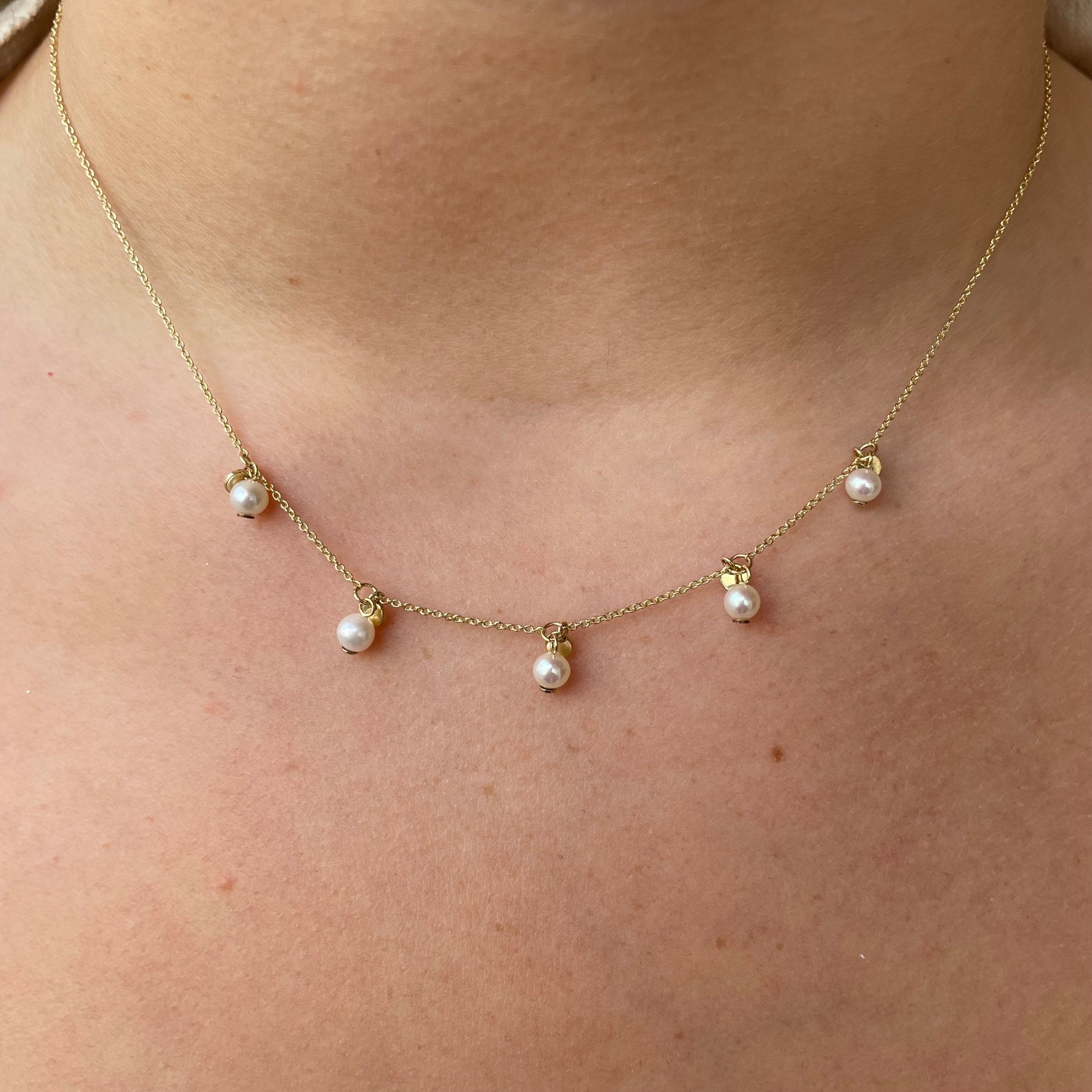 9ct gold pearl fringe necklace with elegant hanging pearls and intricate chain design by G Molins & Company Limited.
