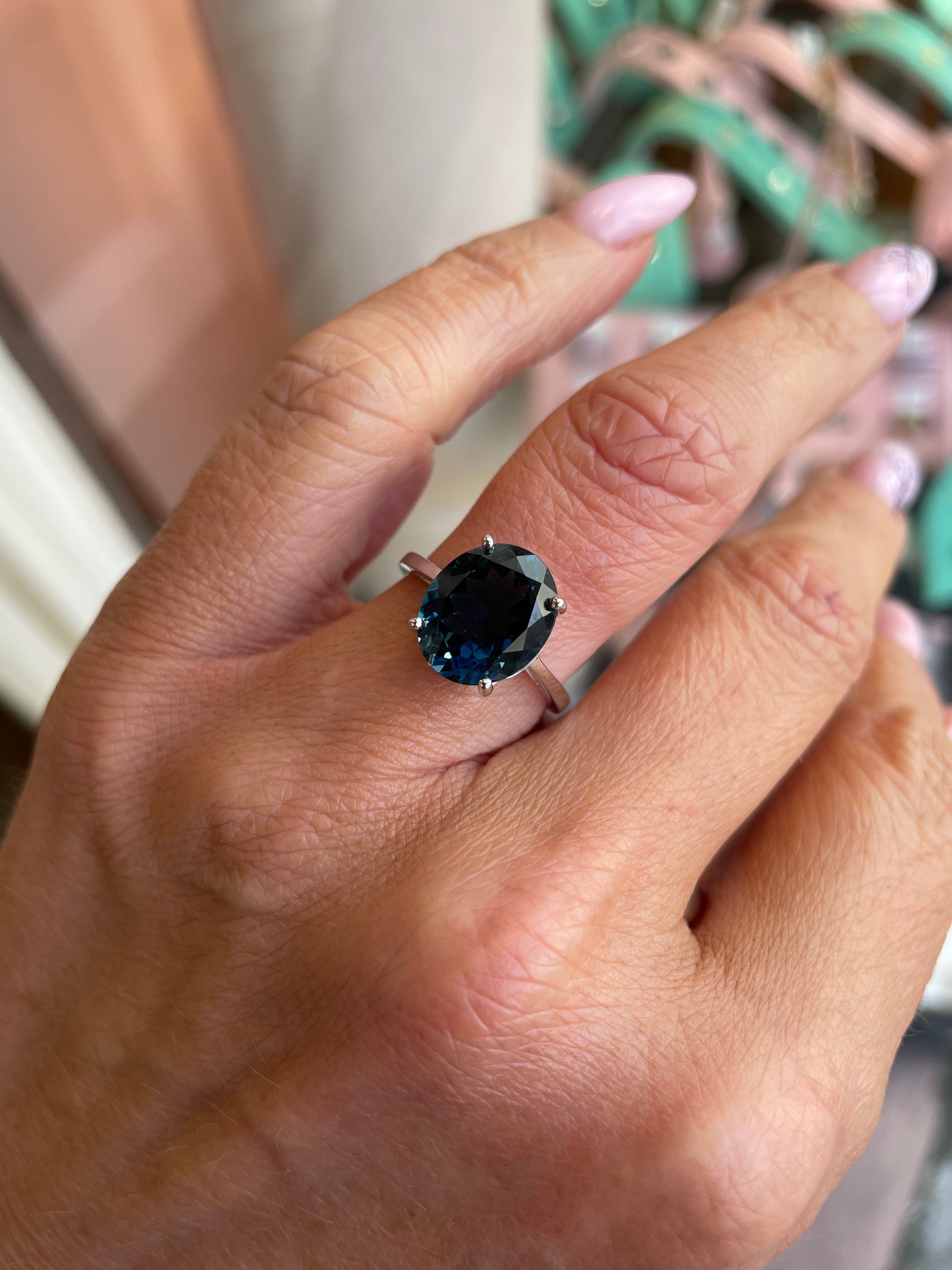 Herbert 9ct white gold oval cut London Blue Topaz ring showcasing a vibrant blue gemstone on a sleek gold band.