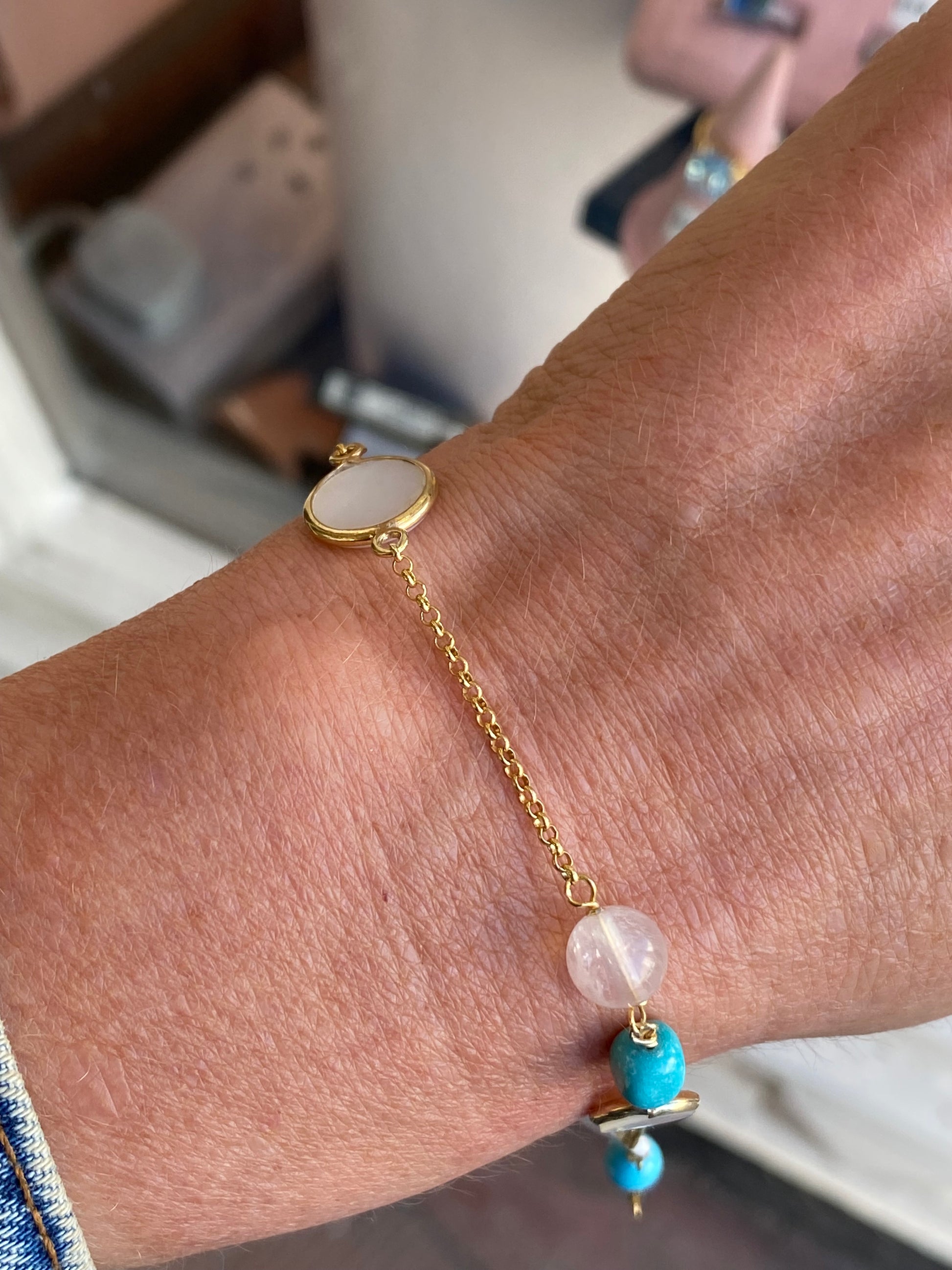 Bruno turquoise, pearl, and mother of pearl bracelet featuring a delicate design with vibrant blue and shiny white accents.