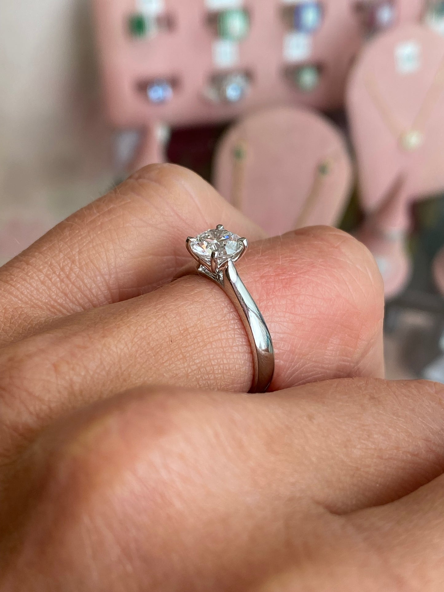 TCA platinum solitaire engagement ring with a 1.12ct certified lab diamond, showcasing a single sparkling diamond set on a sleek band.