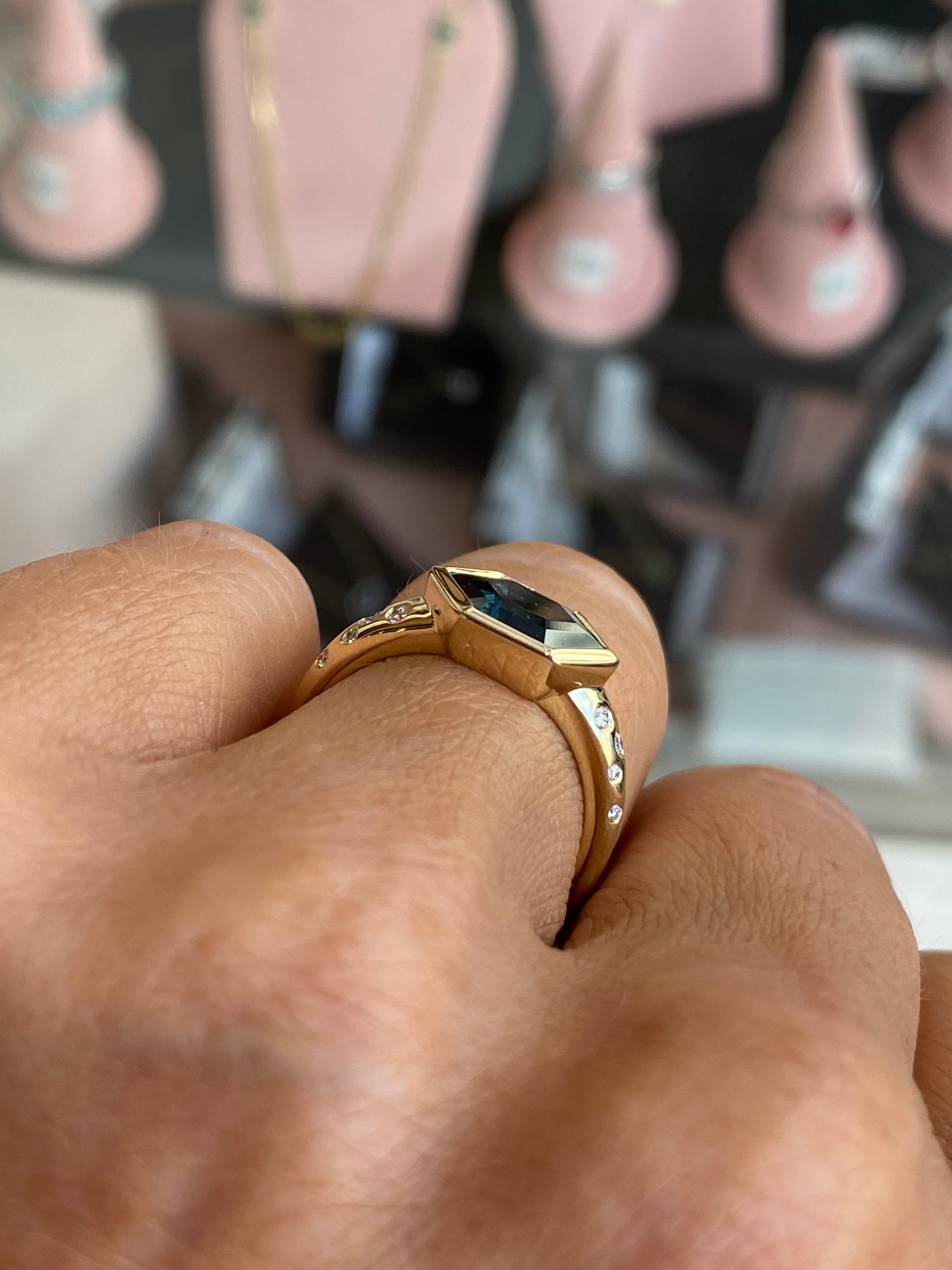 9ct gold London Blue Topaz and diamond ring featuring a central blue topaz gemstone with diamond accents, crafted by TCA.