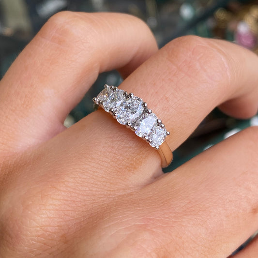 Prima 18ct gold oval five stone eternity ring with a 3.26ct certificated lab diamond setting, showcasing elegant gemstone arrangement.