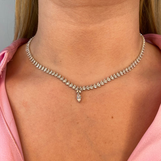 Silver Katelyn necklace by Comero featuring a sleek chain with a delicate pendant, displayed against a neutral background.