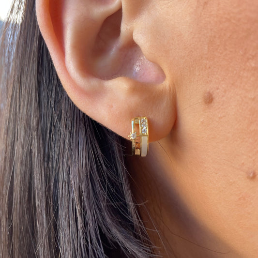 Sunshine CZ Huggie Hoop Earrings by Comero, 12mm gold-plated earrings with sparkling cubic zirconia stones, close-up view.