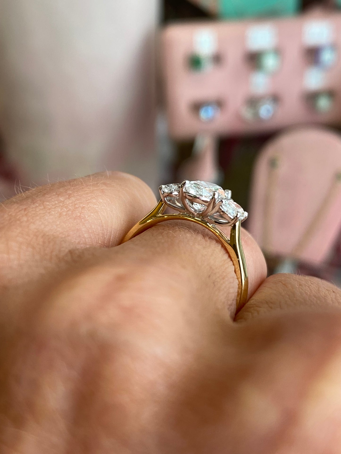 18ct gold oval trilogy engagement ring by TCA with lab-certified 1.58ct diamonds, featuring a three-stone design and elegant craftsmanship.