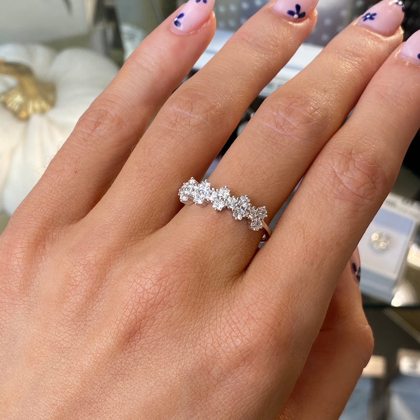 Silver Adira ring by Comero featuring a sleek, polished design with intricate detailing on a white background.