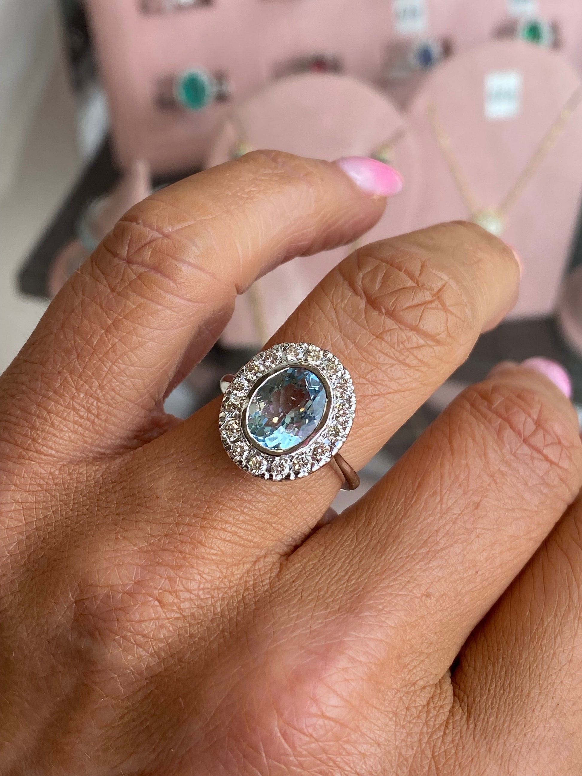 14ct white gold aquamarine and diamond ring featuring a central aquamarine gemstone with diamond accents, elegant and luxurious jewelry piece