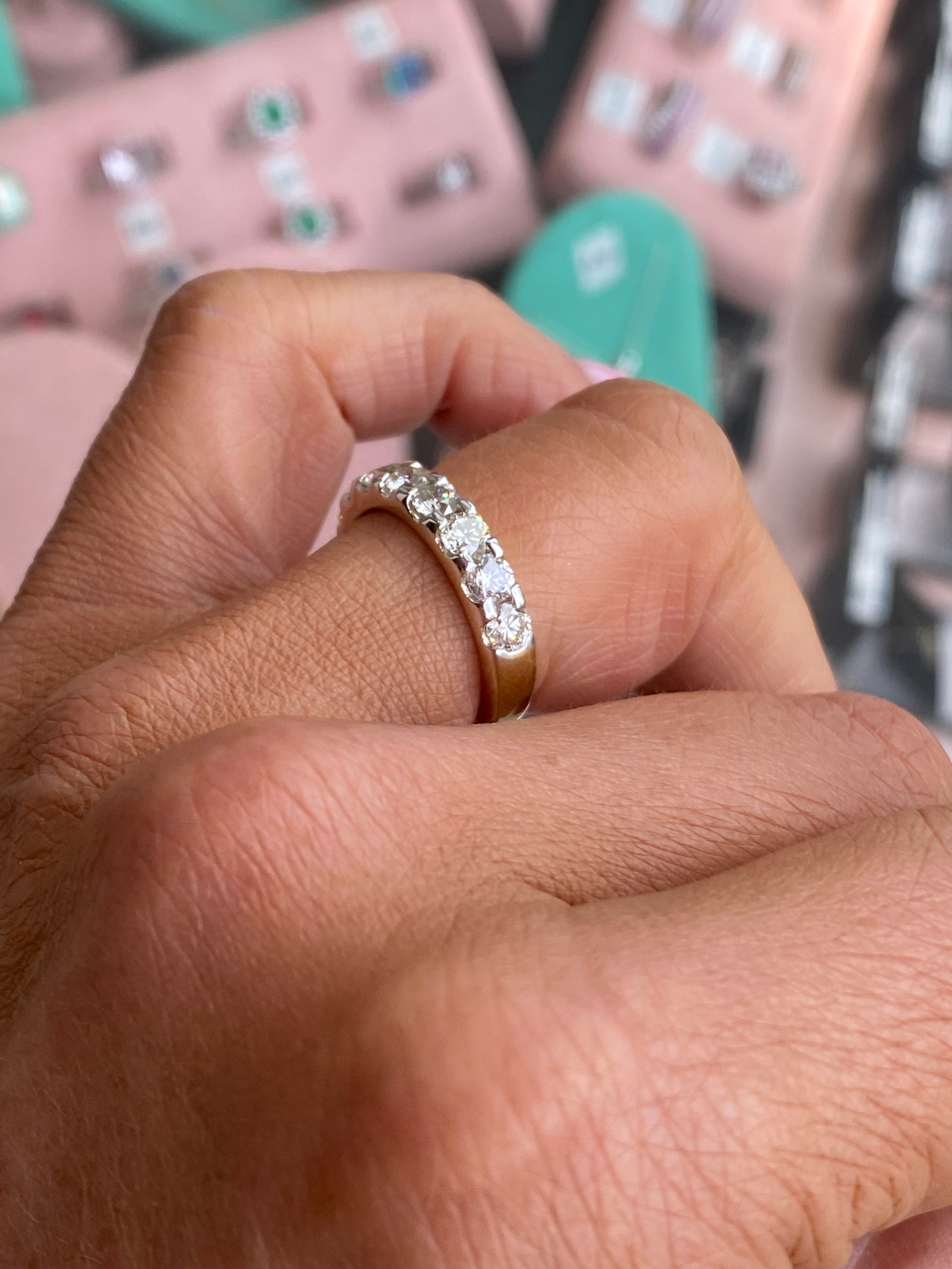 14ct gold diamond eternity ring with 1.65ct of sparkling diamonds, crafted by UJT, shown close-up with detailed design.