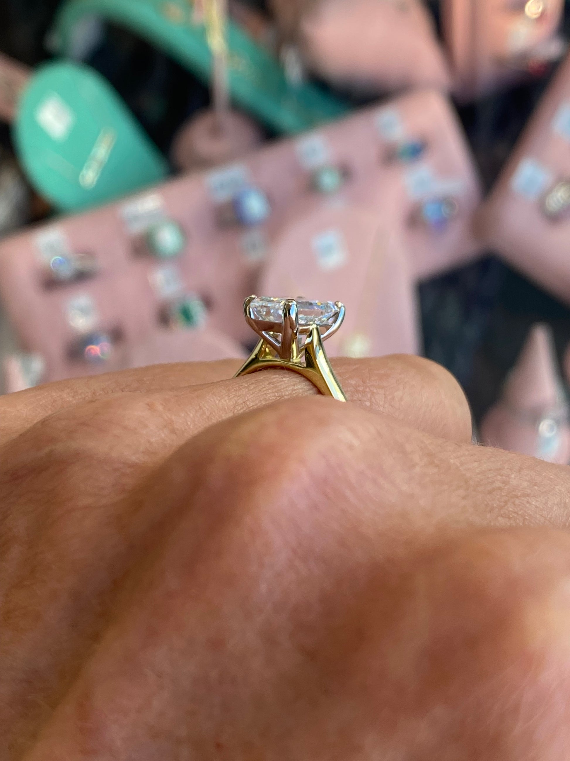 18ct gold emerald cut solitaire engagement ring with a 2.58ct certified lab diamond, featuring a sleek, elegant design from Domino.