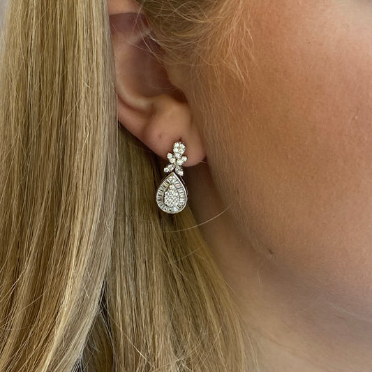 Silver Juno Drop Earrings by Comero featuring sleek, elegant drop design with a polished finish.
