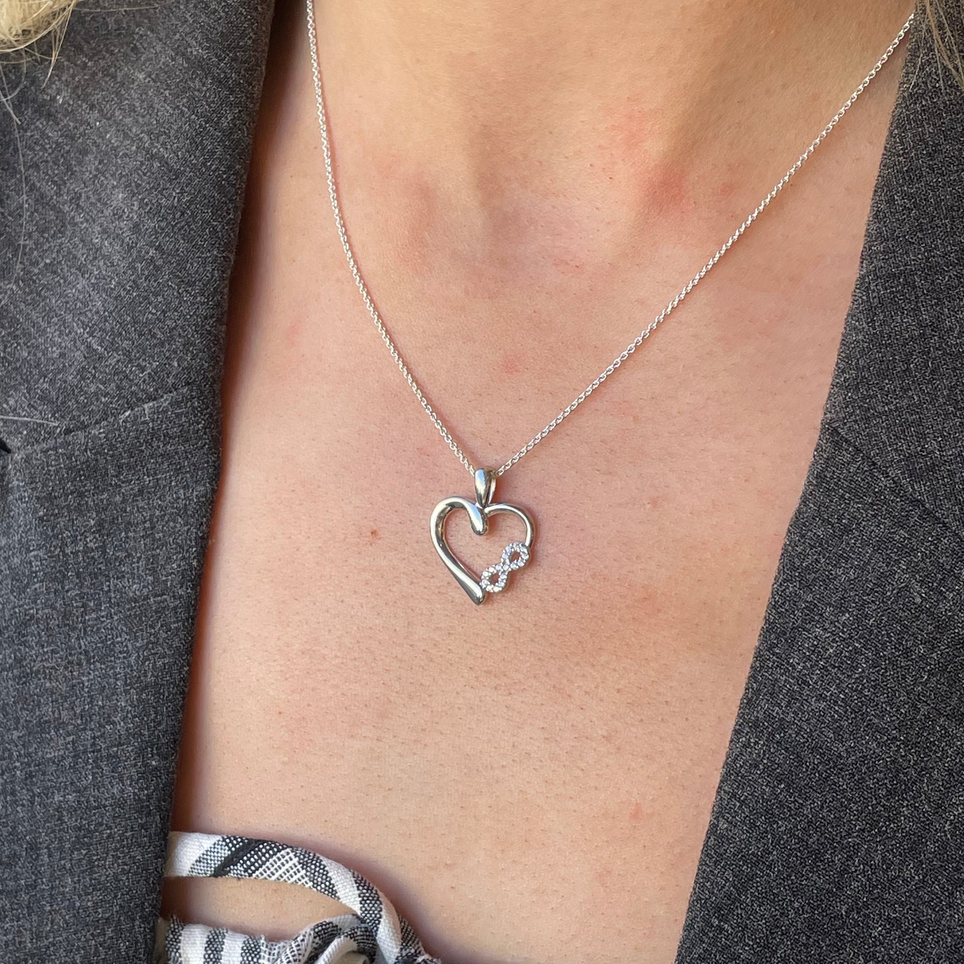 Silver CZ Love Forever pendant necklace by Comero, 18 inches long, featuring a heart design with sparkling cubic zirconia.