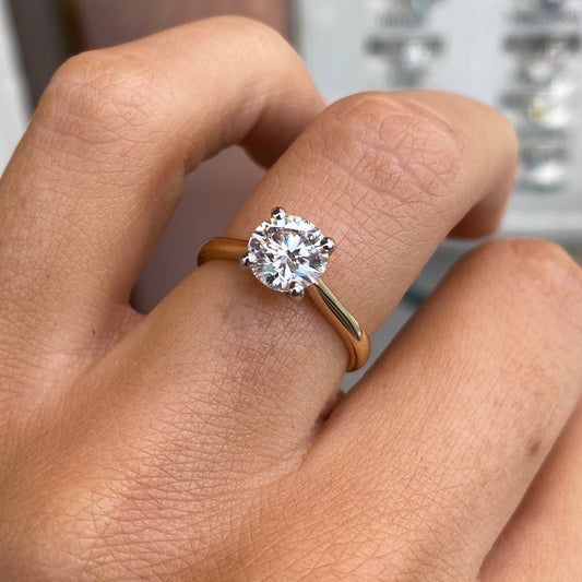 Prima 18ct gold solitaire engagement ring with a 1.26ct certificated lab diamond, showcasing a sleek, elegant design.