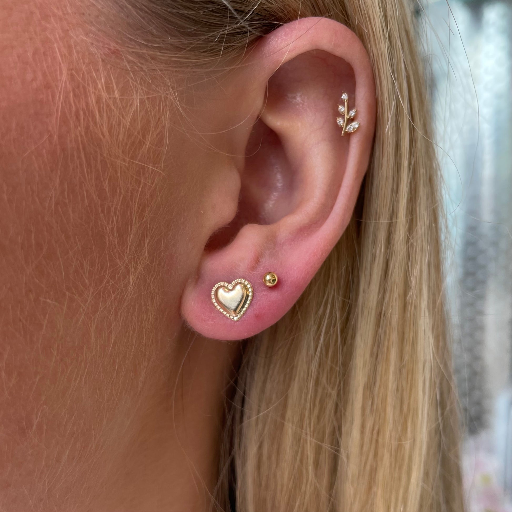9ct gold heart-shaped stud earrings by THC, featuring delicate and pretty jewelry design with a polished finish.
