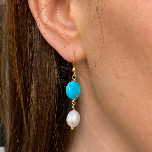 Bruno turquoise and pearl hook drop earrings featuring vibrant turquoise stones and elegant pearl accents.