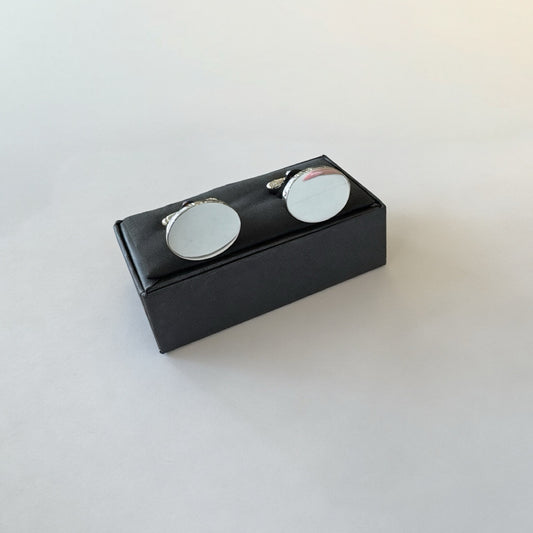 Rhodium plated oval cufflinks by Clandela featuring polished silver finish and classic design for formal wear.