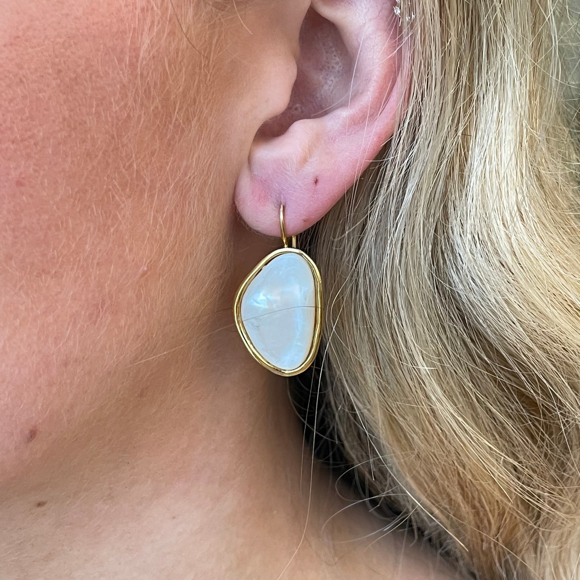 Bruno mother of pearl drop earrings, 32mm by 18mm, featuring iridescent pearl accents and elegant dangle design.
