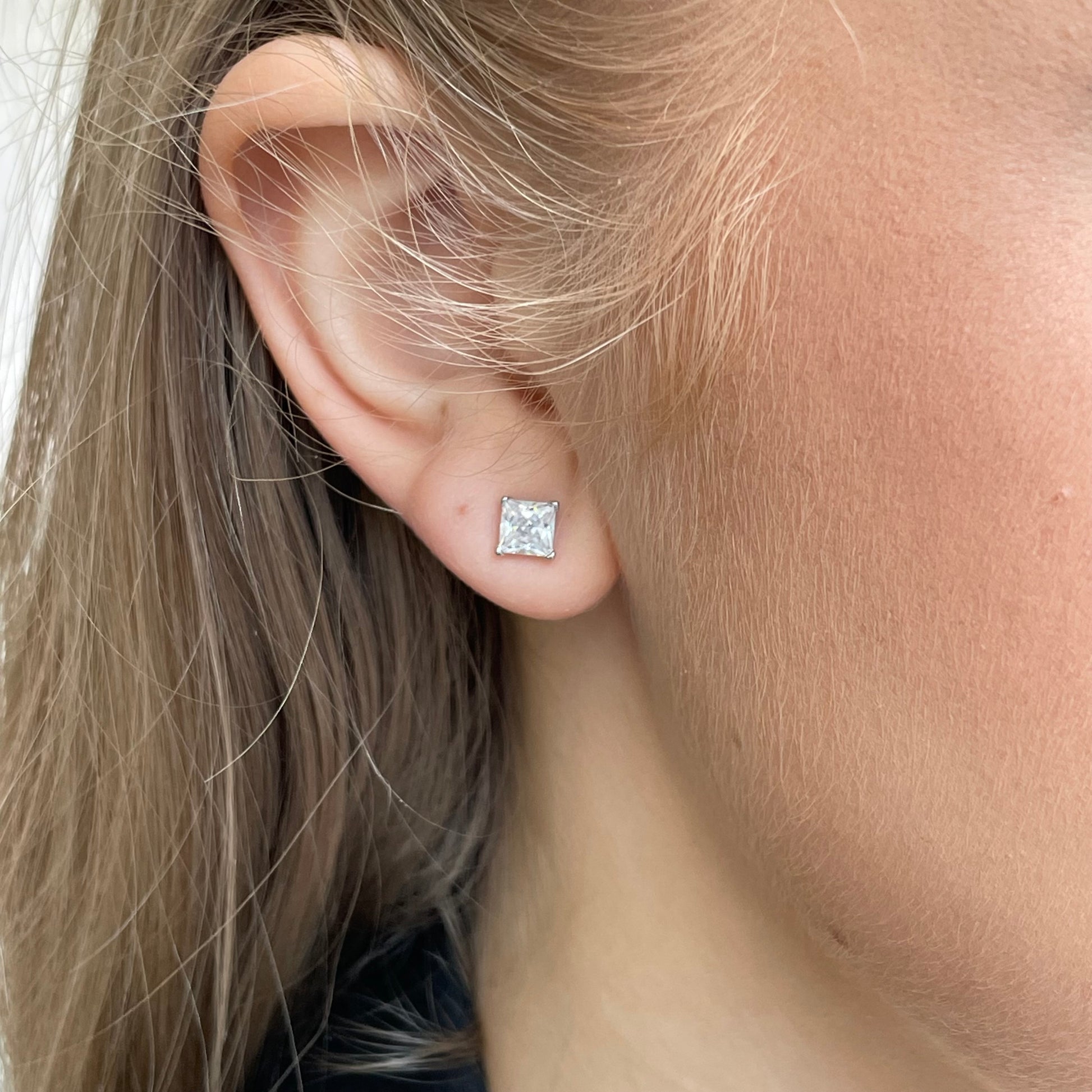 Silver 5mm four claw princess cut CZ stud earrings by Insignia, showcasing sparkling cubic zirconia in a classic earring design.