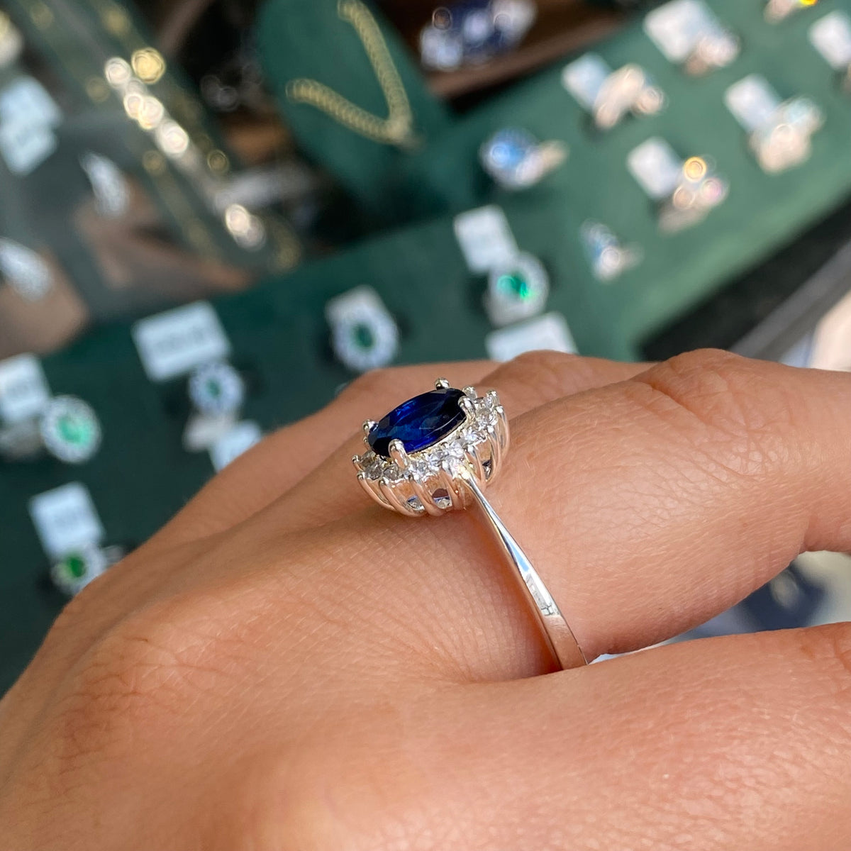 Silver Sapphire CZ Diana Ring by Kurate featuring a sparkling silver band and a central sapphire-colored cubic zirconia gemstone.
