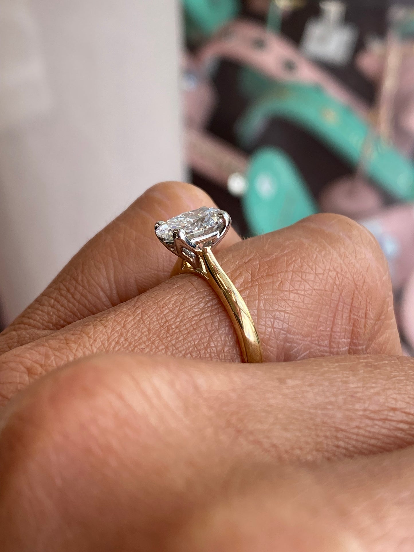Prima 18ct gold oval solitaire engagement ring with a 1.72ct certificated diamond, showcasing a sleek and elegant design.