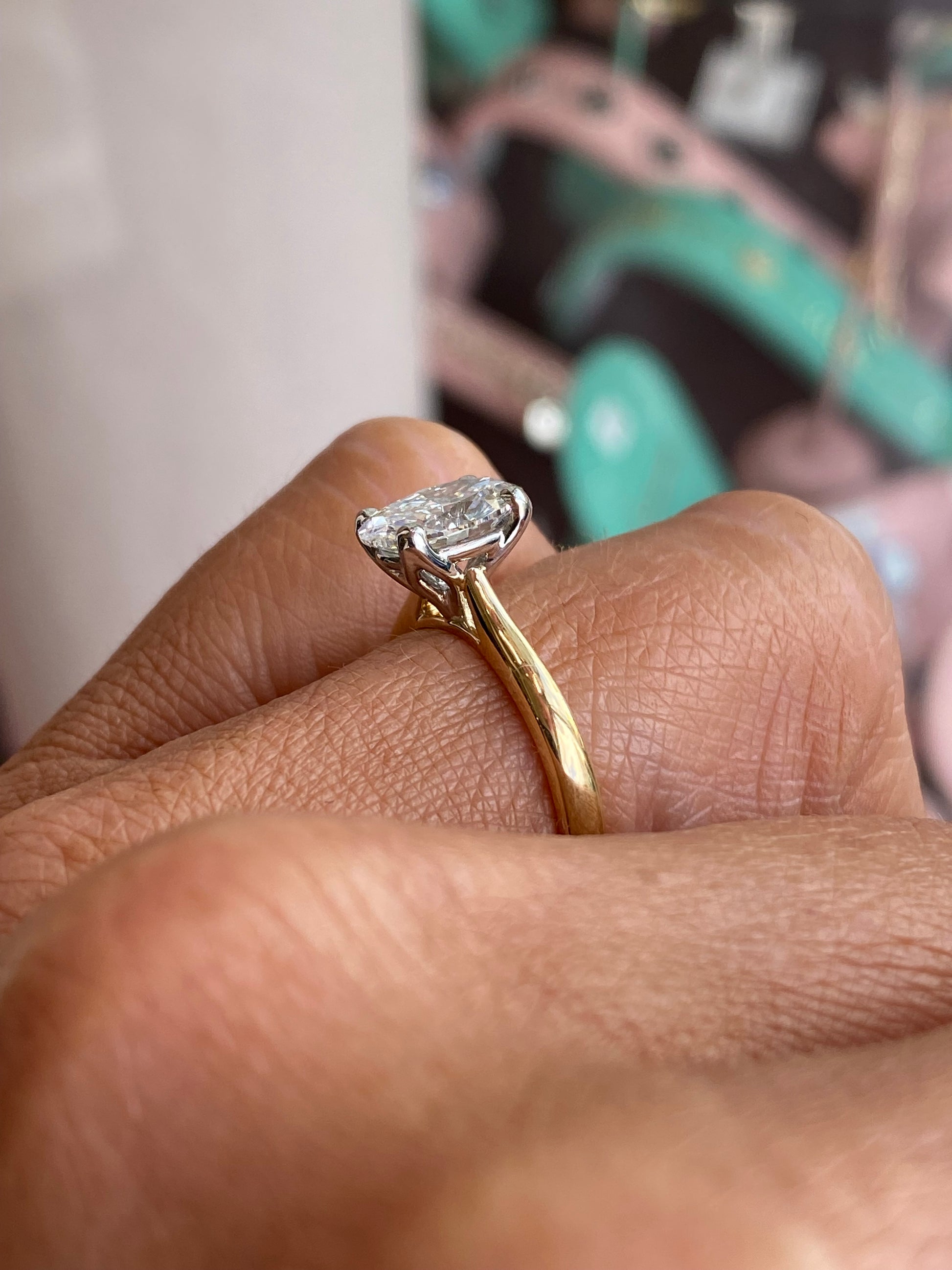 Prima 18ct gold oval solitaire engagement ring with a 1.72ct certificated diamond, showcasing a sleek and elegant design.