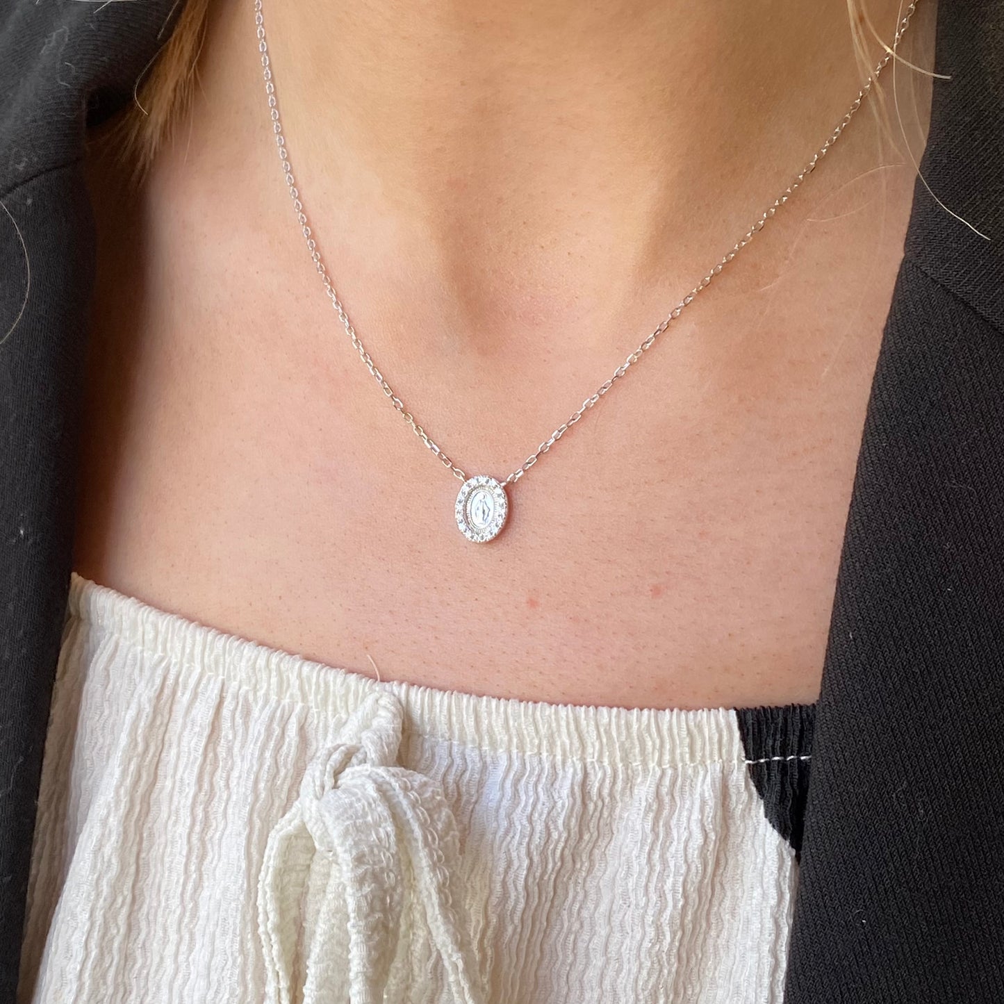 Silver CZ Miraculous Necklace by Comero featuring a detailed silver pendant with sparkling cubic zirconia stones.